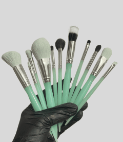 High-quality makeup brushes with mint green handles and soft bristles for professional beauty applic.