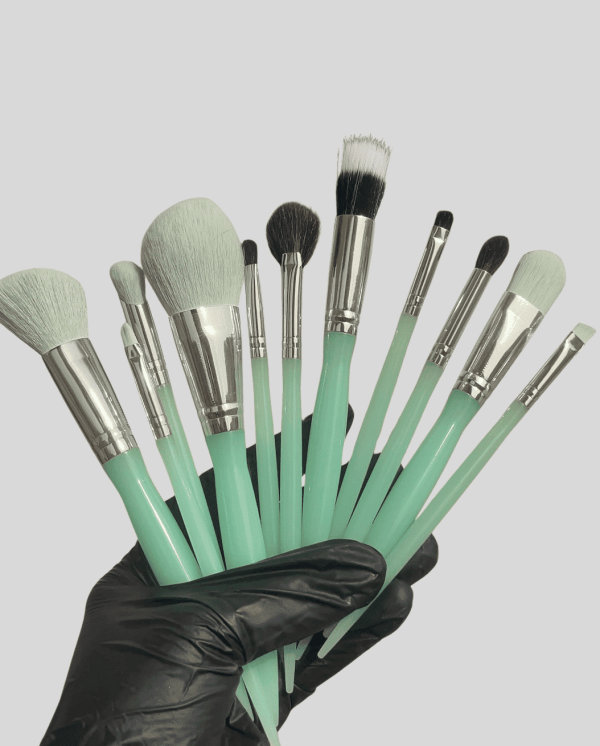 High-quality makeup brushes with mint green handles and soft bristles for professional beauty applic.